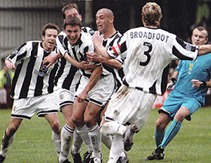 The St. Mirren players celebrate Sutton's winning goal