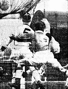 Thirds' Gray challenges McGuigan and Walker as the ball lands on top of the net